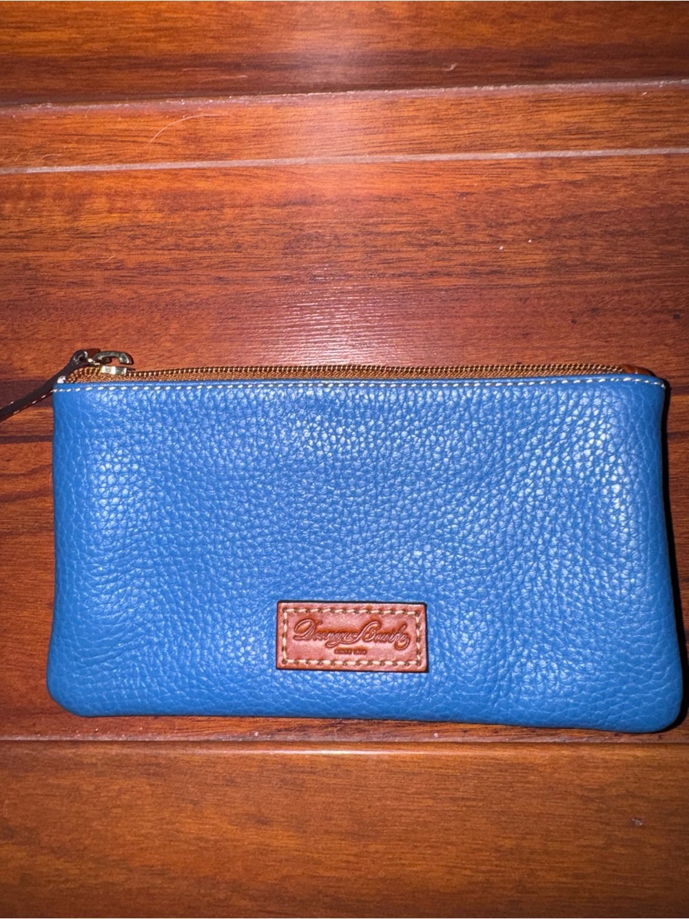 Dooney & Bourke Blue Pebbled Leather Zip Wristlet with Brown Logo Patch